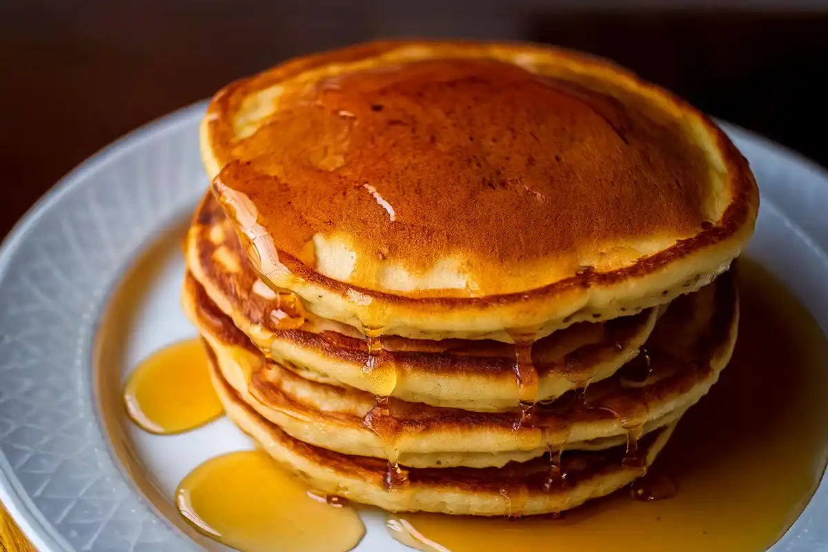 Golden Pancake Stack with Dripping Syrup