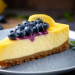 Slice of lemon blueberry cheesecake with creamy layers.